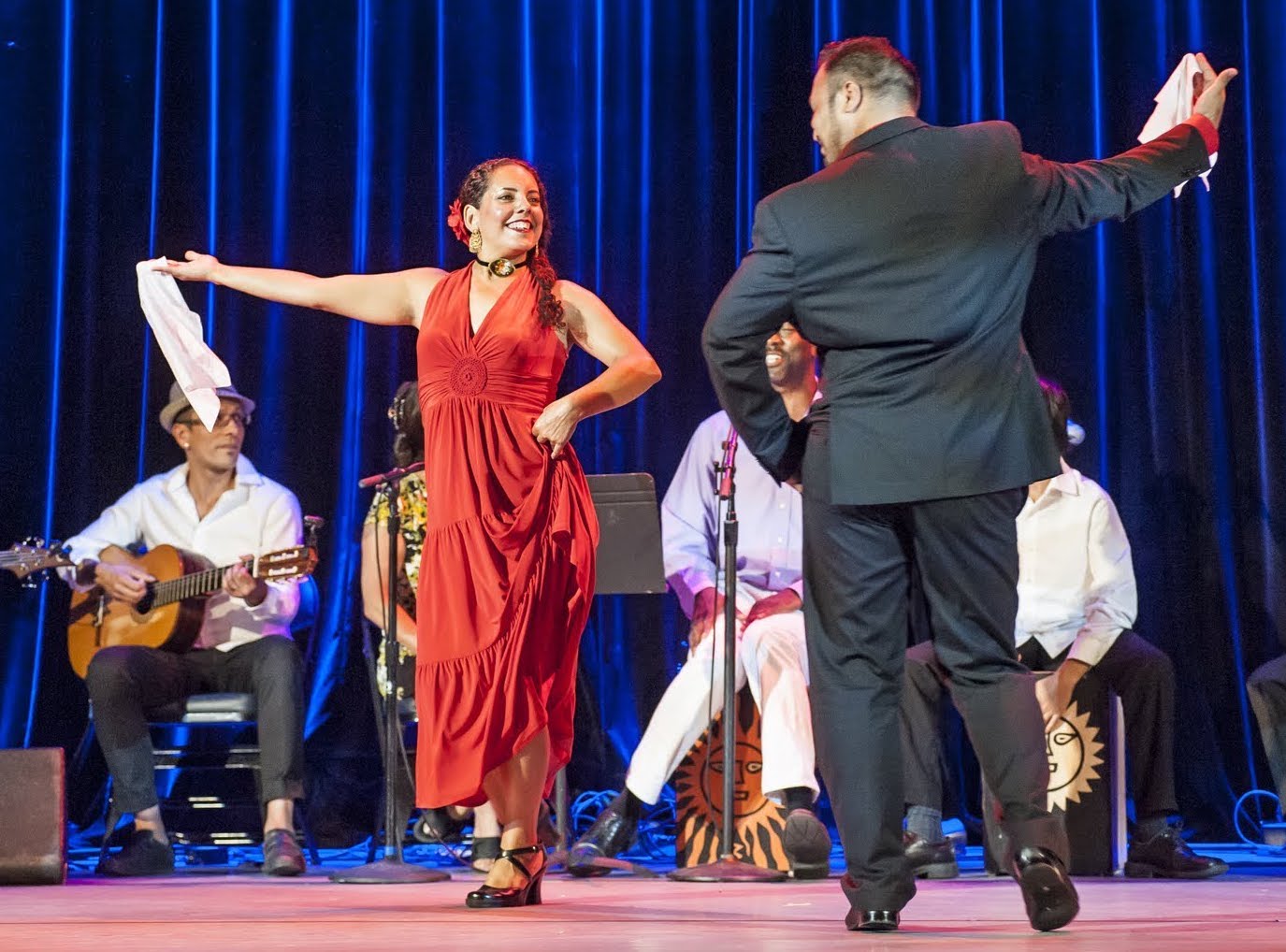 Monica Rojas-Stewart dances in a red dress