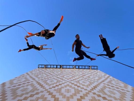 BANDALOOP dancing off side of building 