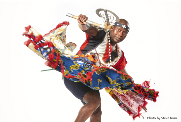 Flyer for Free Masterclass: West African Dance with Live Drumming, picturing Etienne Cakpo in traditional Benin dance clothing, and listing information about the class. 