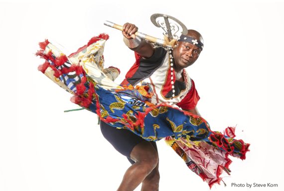 Flyer for Free Masterclass: West African Dance with Live Drumming, picturing Etienne Cakpo in traditional Benin dance clothing, and listing information about the class. 