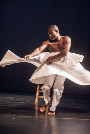 Photo by Erik Stuhaug Etienne dancing in a white skirt