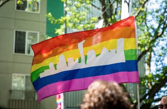 pride flag with Seattle skyline 