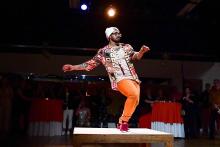 Michael O'Neal dances on a small square stage