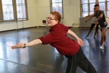 Holley Farmer demonstrating moves to dance students