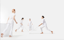 4 dancers carrying white panels in Brian Brooks's DIVISIONS