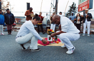 eika Suzumura, left, and Silvio Dos Reis (also known as Mestre Silvinho) of the Union Cultural Center take part in a blessing ceremony for the space on the corner of South Cloverdale Street and Rainier Avenue South in November 2022.