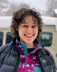 Raquel smiles in the snow