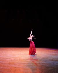 Emily Chen reaching towards upwards 