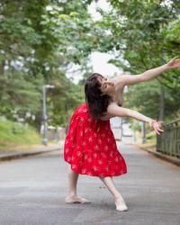 Natalie Fernandi in a red skirt 