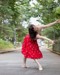 Natalie Fernandi in a red skirt 