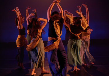 Dancers on stage facing upstage