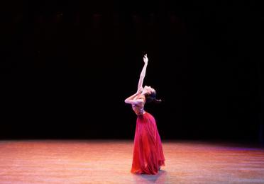 Emily Chen reaching towards upwards 