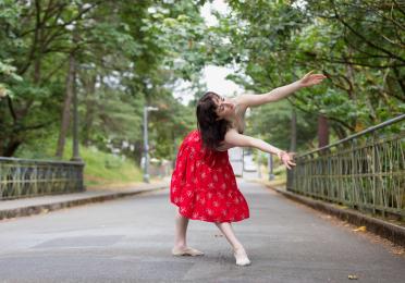 Natalie Fernandi in a red skirt 