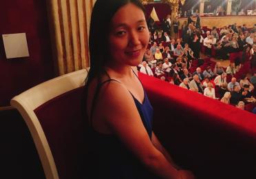 Emily Koya sitting at the opera
