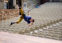 Roel Seeber hangs sideways from the ceiling in a harness.