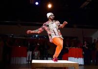Michael O'Neal dances on a small square stage