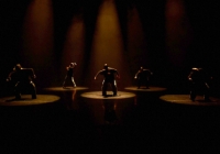 Dancers on stage in pools of light 