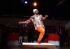 Michael O'Neal dances on a small square stage