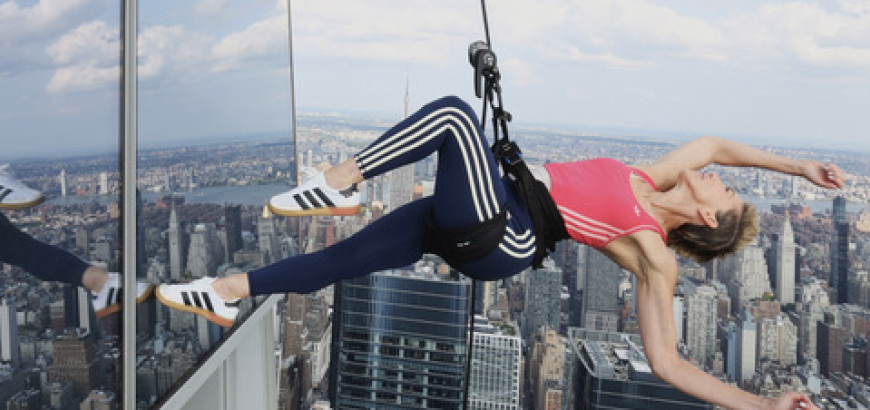 Rachael Lincoln dances above the Manhattan skyline on the side of a skyscraper