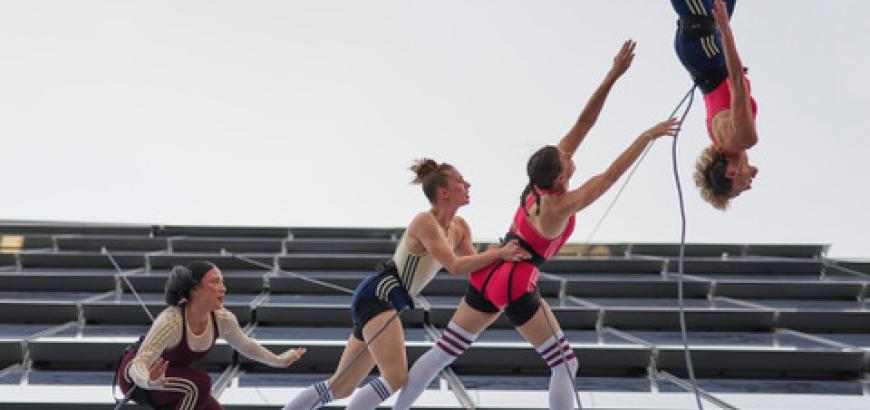 Rachael Lincoln flips upside-down while dancing on side of a skyscraper