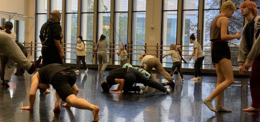 elementary students and UW students practice Capoeira together