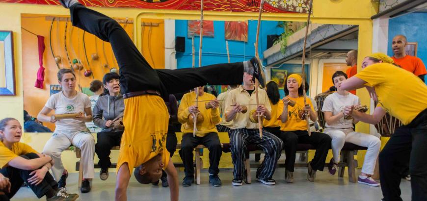 Silvio in handstand playing capoeira