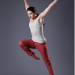 Lucy falls forward with her right leg in passé and her arms wide behind her. 
